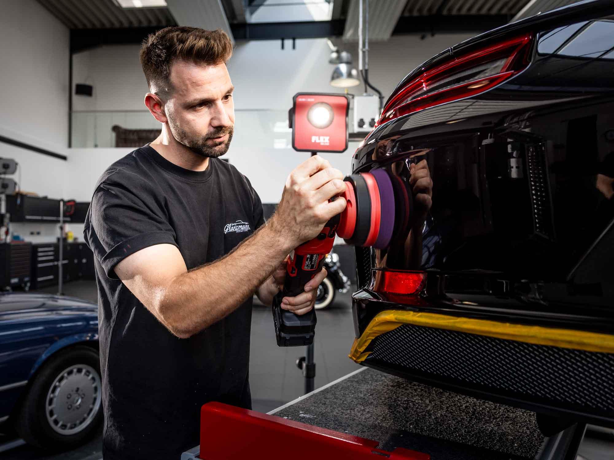 Professional detailer polishes Porsche with FLEX cordless polisher